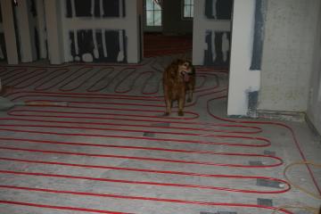 [Radiant heat tubes on first floor before slab poured]